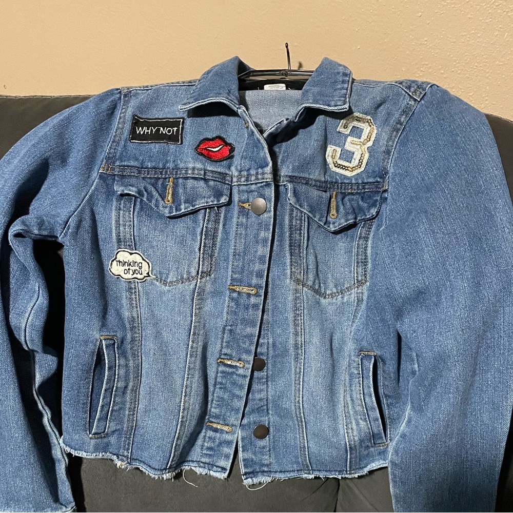 Ladies jeans jacket size medium with patches all over. Smile 😊 message on back